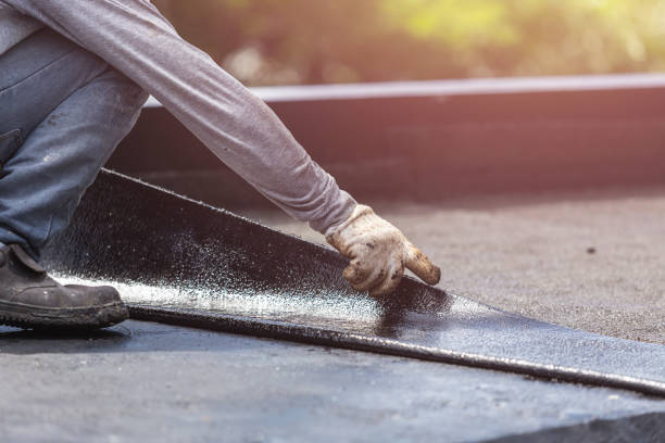 Professional Basement Waterproofing technician working in Ashley, OH